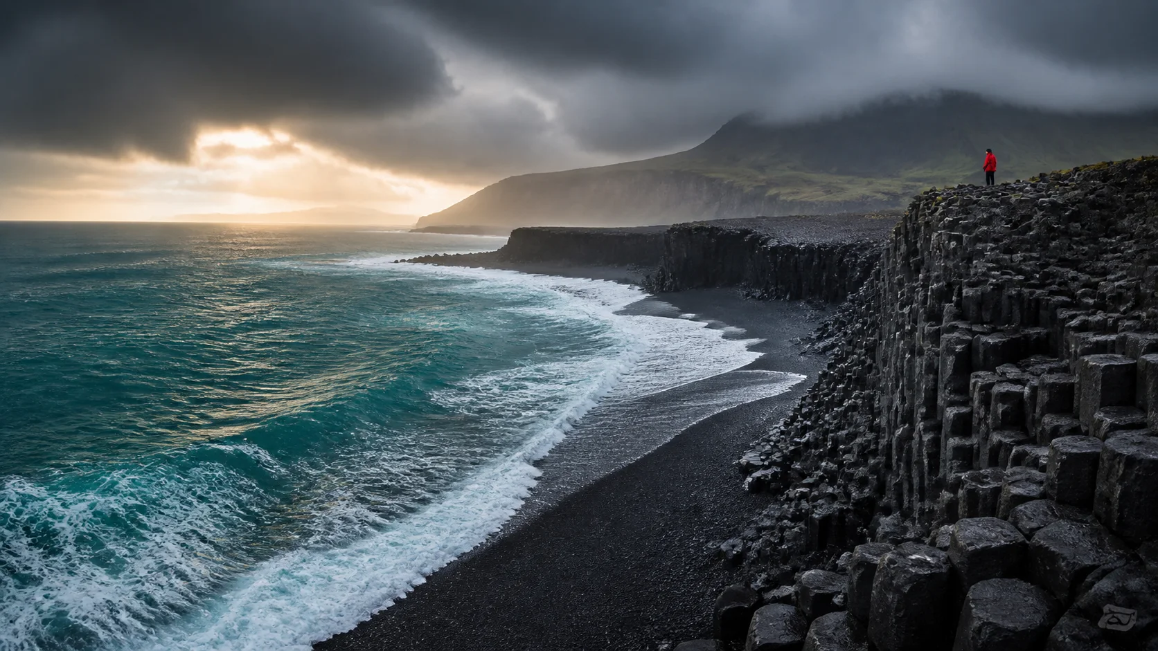 Turquoise waves meeting a black basalt coastline